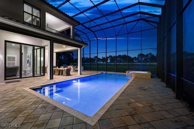 4406 Caldera Cir, Naples, FL 34119 - view of swimming pool with a patio area, glass enclosure, and a pool with connected hot tub