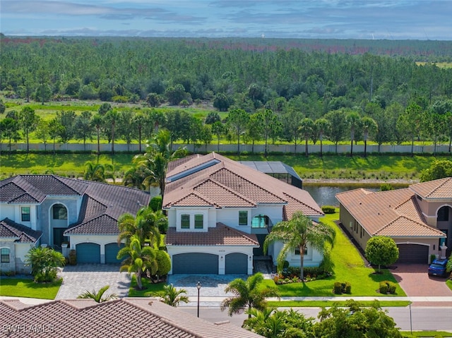 4406 Caldera Cir, Naples, FL 34119 - view from above of property with a heavily wooded area
