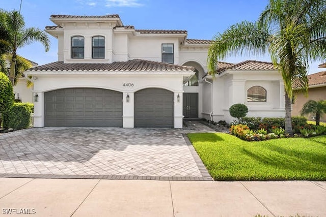 4406 Caldera Cir, Naples, FL 34119 - mediterranean / spanish home with decorative driveway, stucco siding, and a front yard