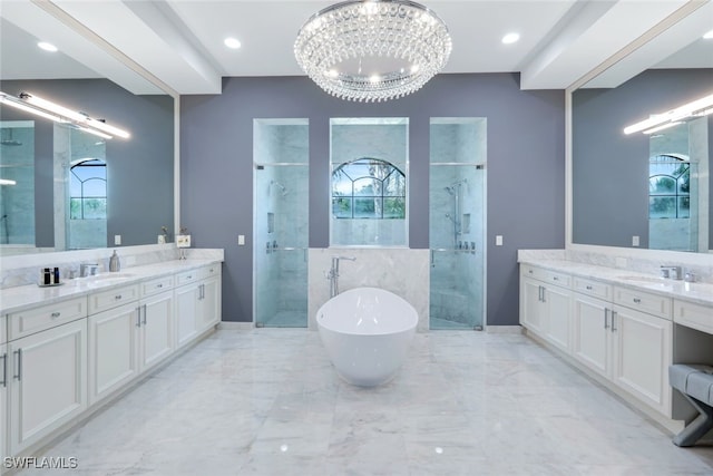 4406 Caldera Cir, Naples, FL 34119 - full bath with a stall shower, two vanities, and plenty of natural light