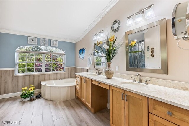 11840 Longshore Way W, Naples, FL 34119 - full bath featuring double vanity, a wainscoted wall, a bath, crown molding, and wood finished floors