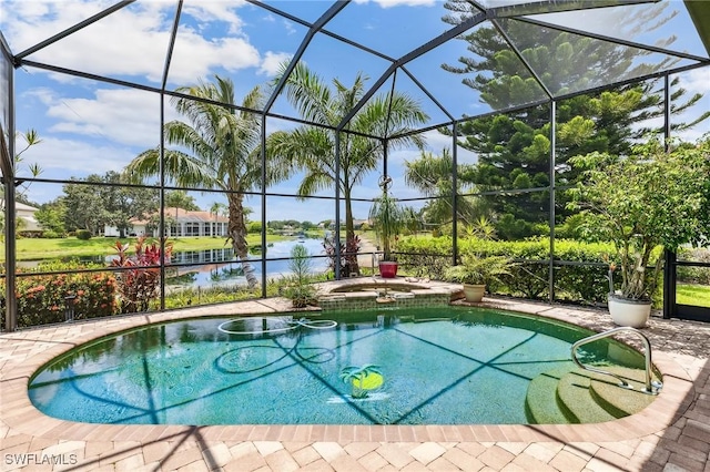 11840 Longshore Way W, Naples, FL 34119 - view of pool featuring a pool with connected hot tub, a lanai, a water view, and a patio