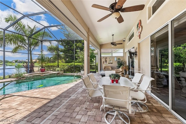 11840 Longshore Way W, Naples, FL 34119 - view of patio with a ceiling fan, a pool with connected hot tub, a lanai, and a water view