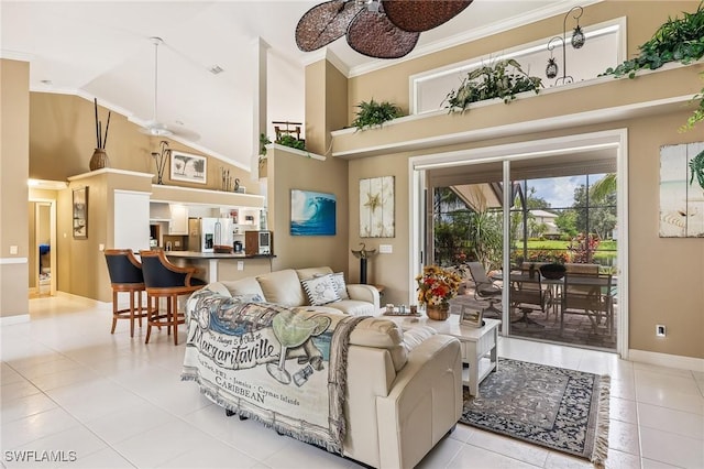 11840 Longshore Way W, Naples, FL 34119 - living room featuring tile patterned floors, high vaulted ceiling, and crown molding