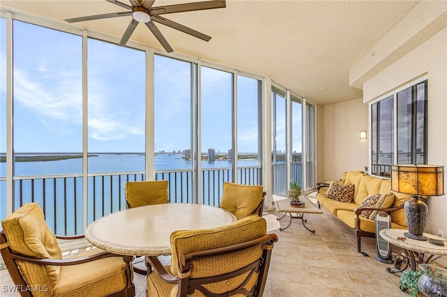 4137 Bay Beach Ln Unit 5P2, Fort Myers Beach, FL 33931 - sunroom / solarium with a water view, tile patterned flooring, and a textured ceiling