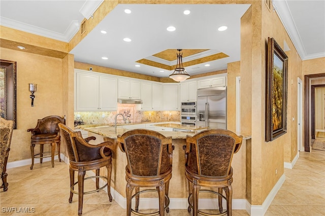 4137 Bay Beach Ln Unit 5P2, Fort Myers Beach, FL 33931 - kitchen with light stone countertops, ornamental molding, white cabinetry, decorative backsplash, and stainless steel appliances