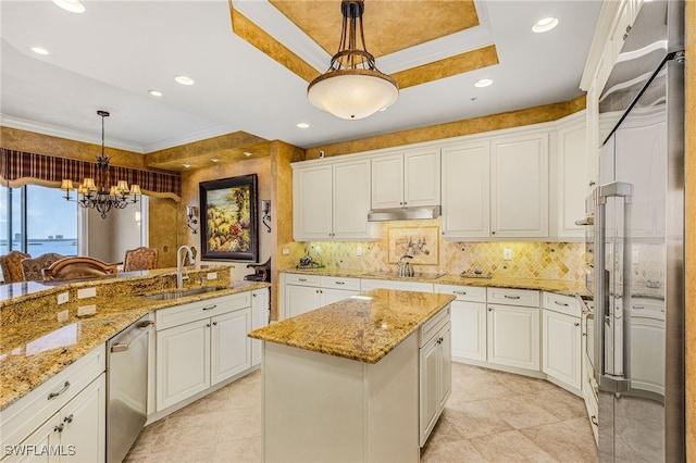 4137 Bay Beach Ln Unit 5P2, Fort Myers Beach, FL 33931 - kitchen featuring appliances with stainless steel finishes, backsplash, a raised ceiling, white cabinetry, and a chandelier