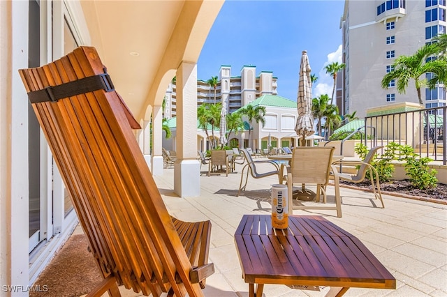 4137 Bay Beach Ln Unit 5P2, Fort Myers Beach, FL 33931 - view of patio featuring outdoor dining space