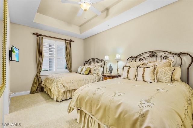 4137 Bay Beach Ln Unit 5P2, Fort Myers Beach, FL 33931 - bedroom featuring light colored carpet, a raised ceiling, and a ceiling fan