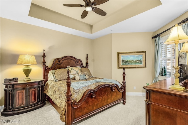 4137 Bay Beach Ln Unit 5P2, Fort Myers Beach, FL 33931 - bedroom featuring light colored carpet, a tray ceiling, and ceiling fan
