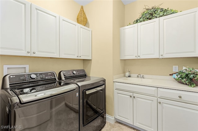 4137 Bay Beach Ln Unit 5P2, Fort Myers Beach, FL 33931 - laundry area with independent washer and dryer, cabinet space, and light tile patterned flooring