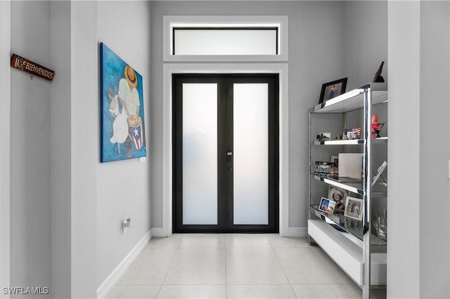 2642 10th Ave NE, Naples, FL 34120 - entryway with french doors and light tile patterned floors