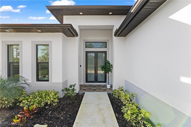 2642 10th Ave NE, Naples, FL 34120 - property entrance with stucco siding and french doors