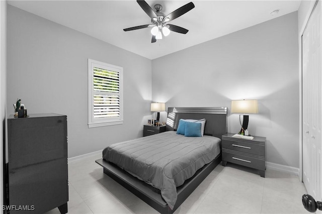 2642 10th Ave NE, Naples, FL 34120 - bedroom featuring light tile patterned flooring, a ceiling fan, and a closet