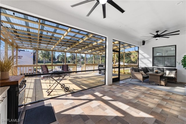 2642 10th Ave NE, Naples, FL 34120 - sunroom / solarium featuring ceiling fan, outdoor lounge area, and plenty of natural light