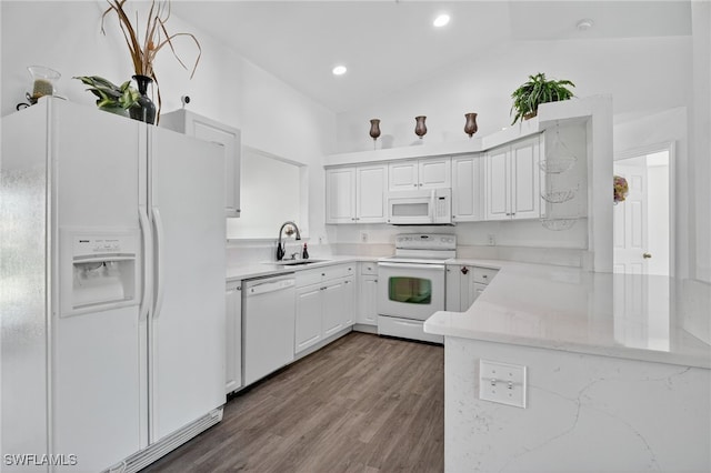 1905 SW 11th St, Cape Coral, FL 33991 - kitchen with white appliances, white cabinets, dark wood-type flooring, a peninsula, and light stone counters