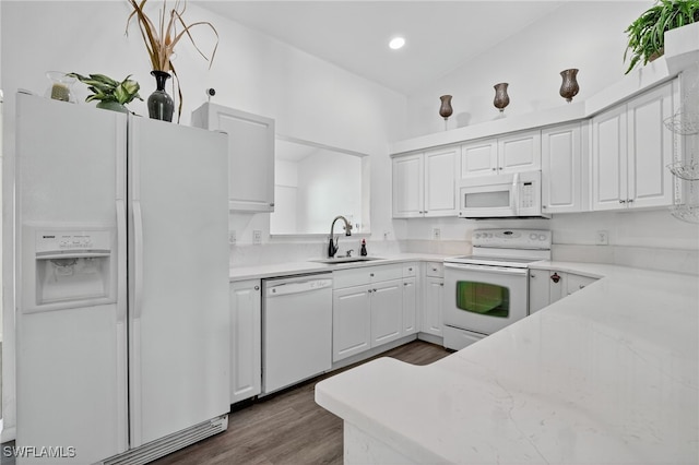 1905 SW 11th St, Cape Coral, FL 33991 - kitchen featuring white appliances, dark wood-style flooring, white cabinetry, recessed lighting, and light stone counters