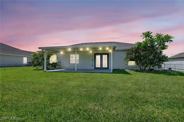 1905 SW 11th St, Cape Coral, FL 33991 - rear view of house with stucco siding, a patio area, and french doors