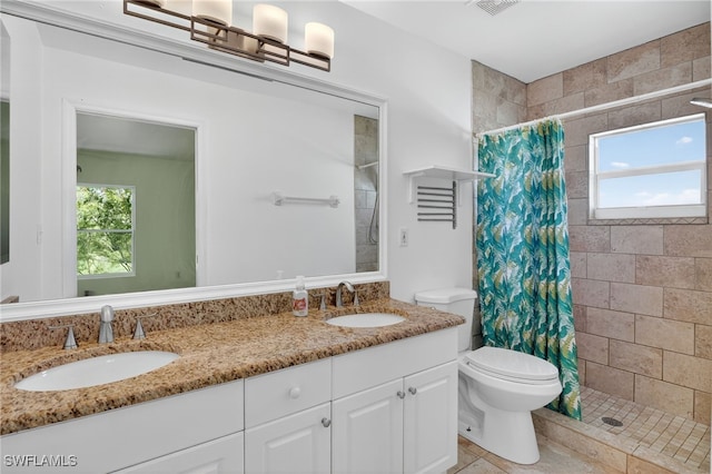 1905 SW 11th St, Cape Coral, FL 33991 - full bathroom featuring double vanity and a tile shower