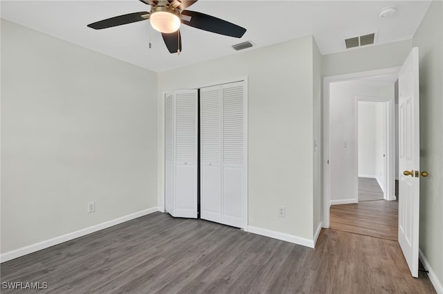 1905 SW 11th St, Cape Coral, FL 33991 - unfurnished bedroom with wood finished floors, a closet, and a ceiling fan