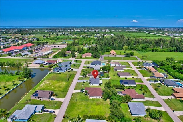 1905 SW 11th St, Cape Coral, FL 33991 - aerial view of property and surrounding area with a large body of water and nearby suburban area