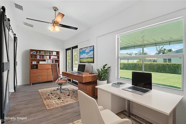 1905 SW 11th St, Cape Coral, FL 33991 - home office with wood finished floors, healthy amount of natural light, vaulted ceiling, and a ceiling fan
