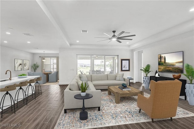 16272 Wax Myrtle St, Punta Gorda, FL 33982 - living room featuring ceiling fan, dark wood finished floors, recessed lighting, and a raised ceiling