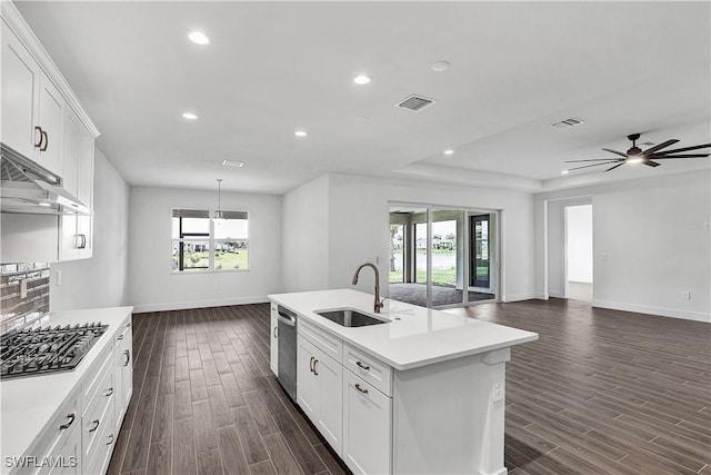 16272 Wax Myrtle St, Punta Gorda, FL 33982 - kitchen with stainless steel appliances, open floor plan, dark wood-type flooring, light countertops, and a ceiling fan