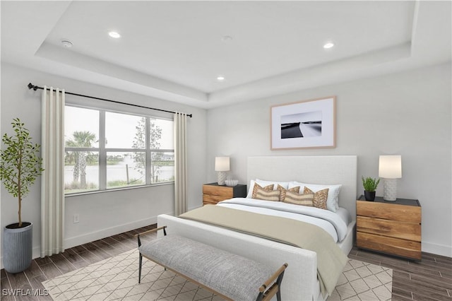 16272 Wax Myrtle St, Punta Gorda, FL 33982 - bedroom with a tray ceiling, wood tiled floors, and recessed lighting