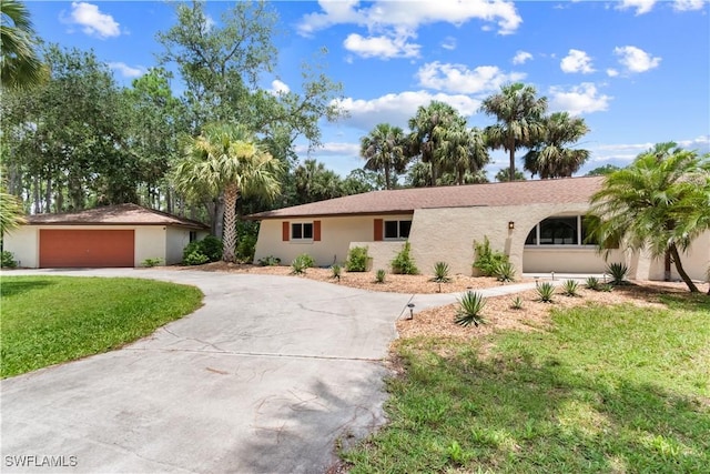 18381 Panther Trail Ln, North Fort Myers, FL 33917 - ranch-style house featuring driveway, a garage, a front yard, and stucco siding