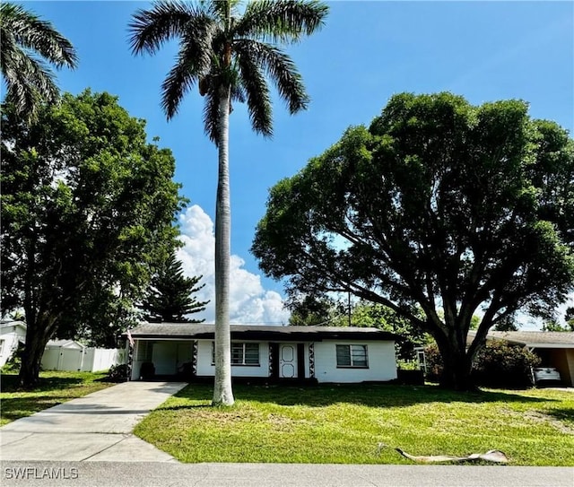 1427 Charles Rd, Fort Myers, FL 33919 - ranch-style house featuring a carport and driveway