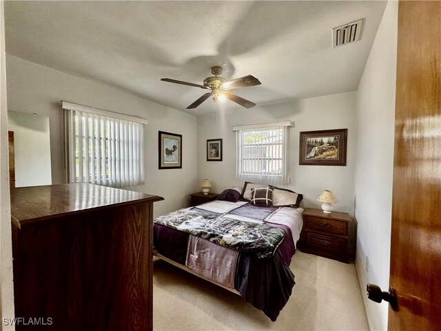 1427 Charles Rd, Fort Myers, FL 33919 - bedroom featuring light carpet and a ceiling fan