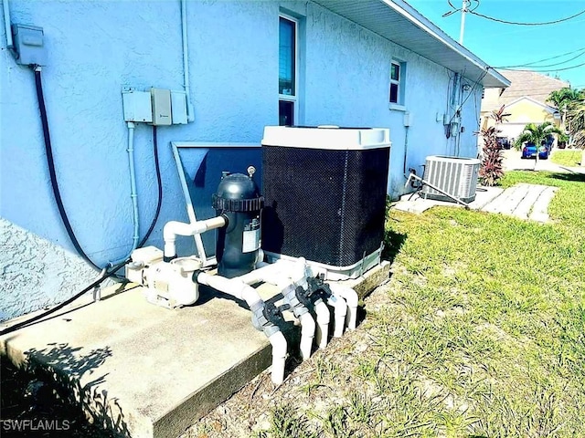 4619 SW 20th Pl, Cape Coral, FL 33914 - exterior view of a central AC unit and stucco siding