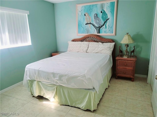 4619 SW 20th Pl, Cape Coral, FL 33914 - bedroom with light tile patterned floors and baseboards