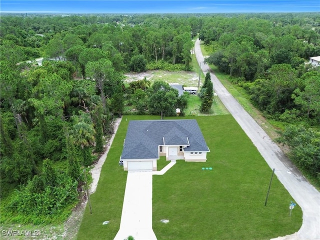 933 Anthony St E, Lehigh Acres, FL 33974 - aerial view of property and surrounding area featuring a forest