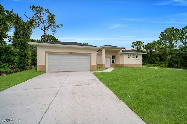 933 Anthony St E, Lehigh Acres, FL 33974 - prairie-style home featuring stucco siding, driveway, a front lawn, and a garage