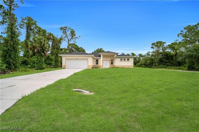 933 Anthony St E, Lehigh Acres, FL 33974 - view of front facade with a garage, a front yard, stucco siding, and driveway