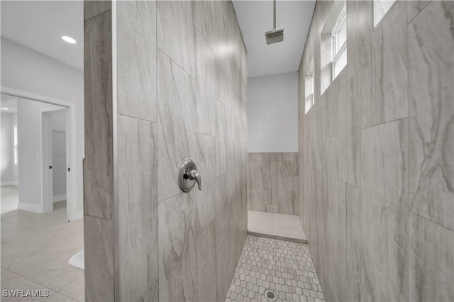 933 Anthony St E, Lehigh Acres, FL 33974 - full bathroom featuring a tile shower, tile patterned floors, recessed lighting, and tile walls