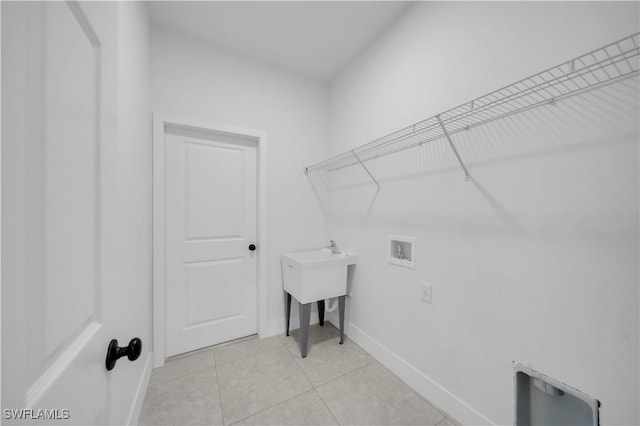 933 Anthony St E, Lehigh Acres, FL 33974 - laundry room with washer hookup and light tile patterned flooring