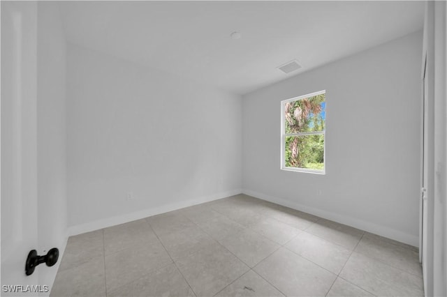 933 Anthony St E, Lehigh Acres, FL 33974 - unfurnished room with tile patterned floors