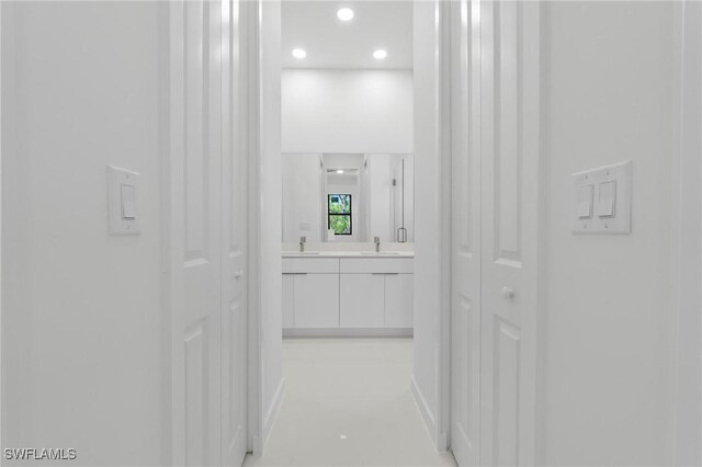 720 Clancy St E, Lehigh Acres, FL 33974 - hallway featuring a sink and recessed lighting