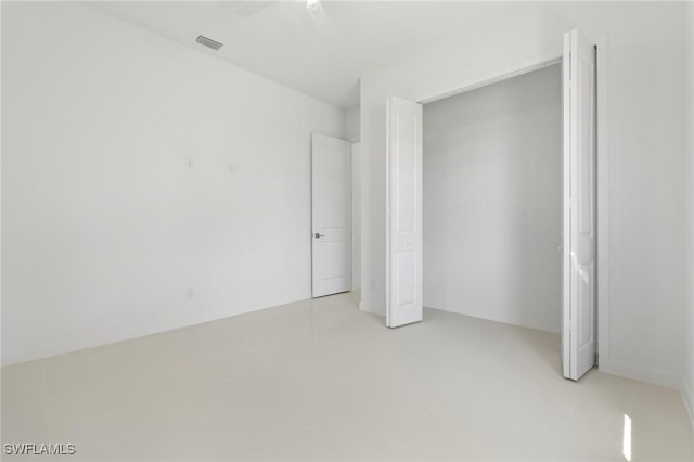 720 Clancy St E, Lehigh Acres, FL 33974 - unfurnished bedroom featuring a closet