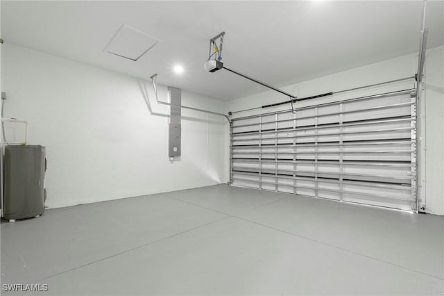 726 Cardinal St E, Lehigh Acres, FL 33974 - garage featuring a garage door opener, water heater, and electric panel