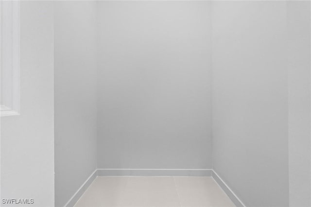 726 Cardinal St E, Lehigh Acres, FL 33974 - unfurnished room with baseboards and light tile patterned floors