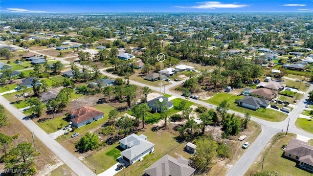726 Cardinal St E, Lehigh Acres, FL 33974 - aerial view of property and surrounding area with nearby suburban area