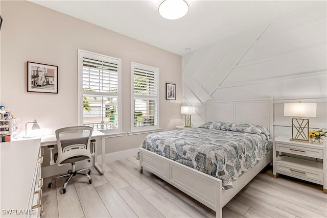 3829 Helmsman Dr, Naples, FL 34120 - bedroom with light wood finished floors and a desk