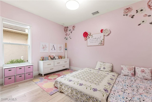 3829 Helmsman Dr, Naples, FL 34120 - bedroom with light wood-style flooring and baseboards