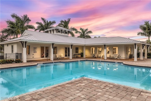 3829 Helmsman Dr, Naples, FL 34120 - community pool featuring a patio area and french doors