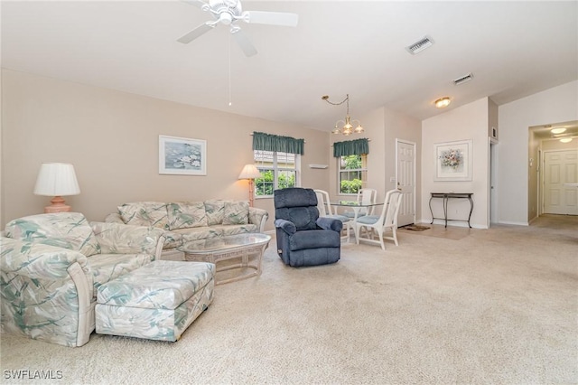 9322 Aegean Cir, Lehigh Acres, FL 33936 - living area with a ceiling fan, carpet flooring, lofted ceiling, and a chandelier