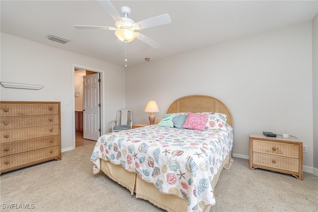9322 Aegean Cir, Lehigh Acres, FL 33936 - carpeted bedroom with baseboards and ceiling fan